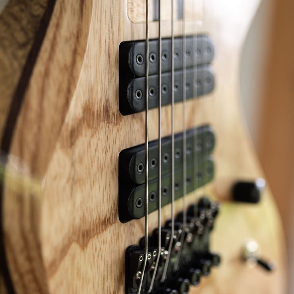 constance 7 string headless guitar swamp ash top holighaus pickups closeup