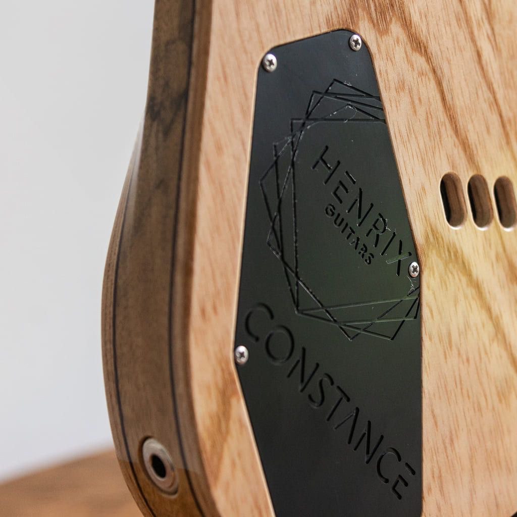 constance 7 string headless guitar swamp ash top electronic cavity closeup