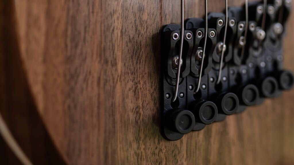 constance 6 string headless guitar riviera tuning machines closeup