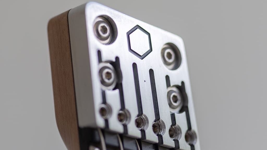 constance 6 string headless guitar headpiece closeup