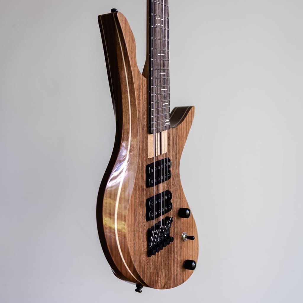 constance 6 string headless guitar body closeup